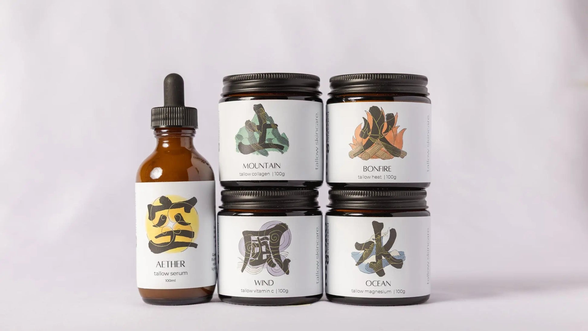 Set of five of myoko embodied tallow products with labels on a light gray background