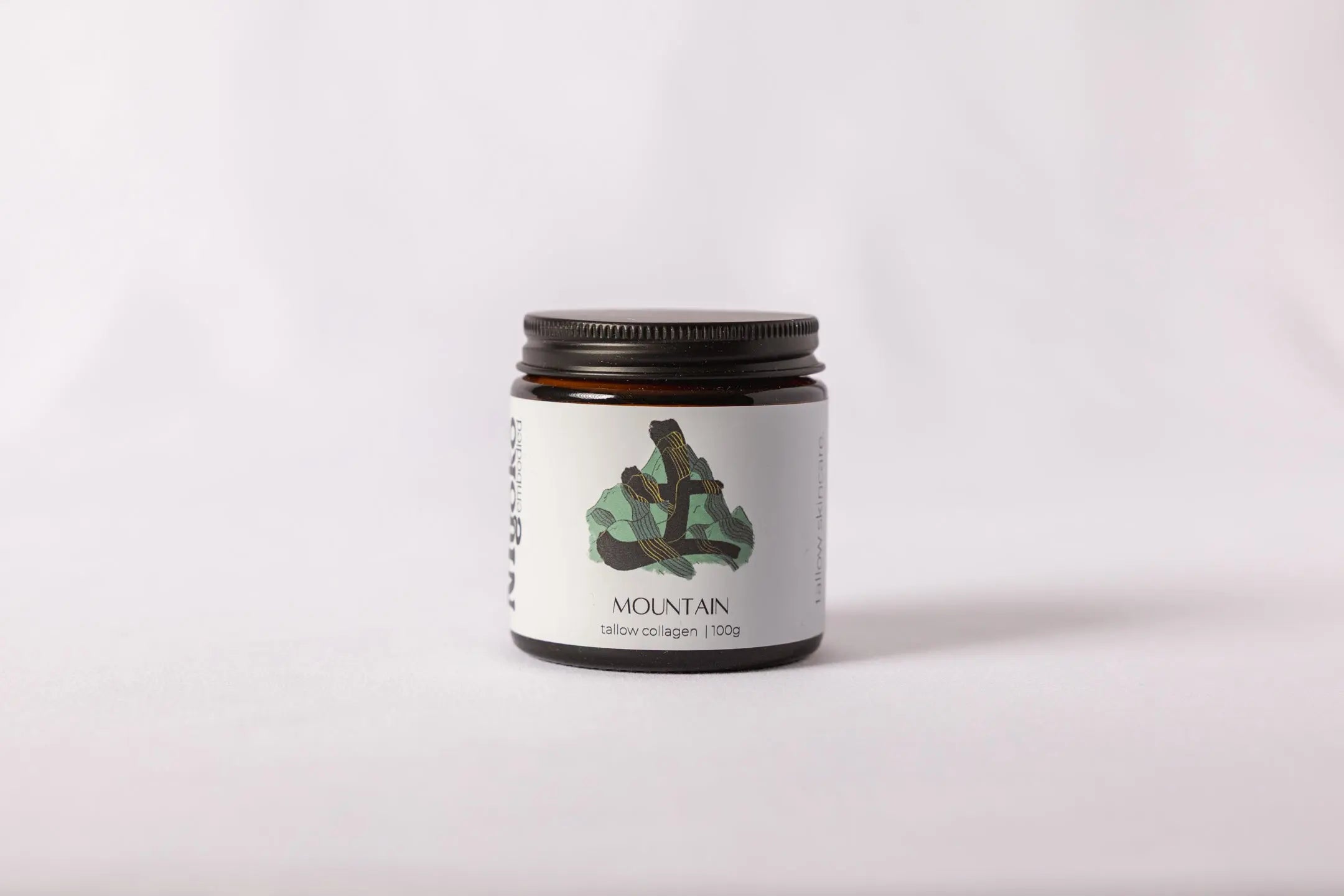 Jar with a label featuring a mountain design on a white background