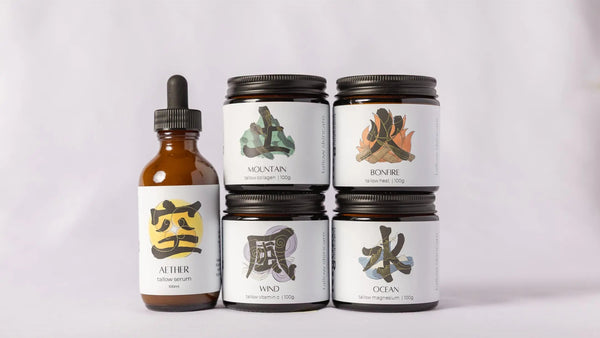 Set of five of myoko embodied tallow products with labels on a light gray background